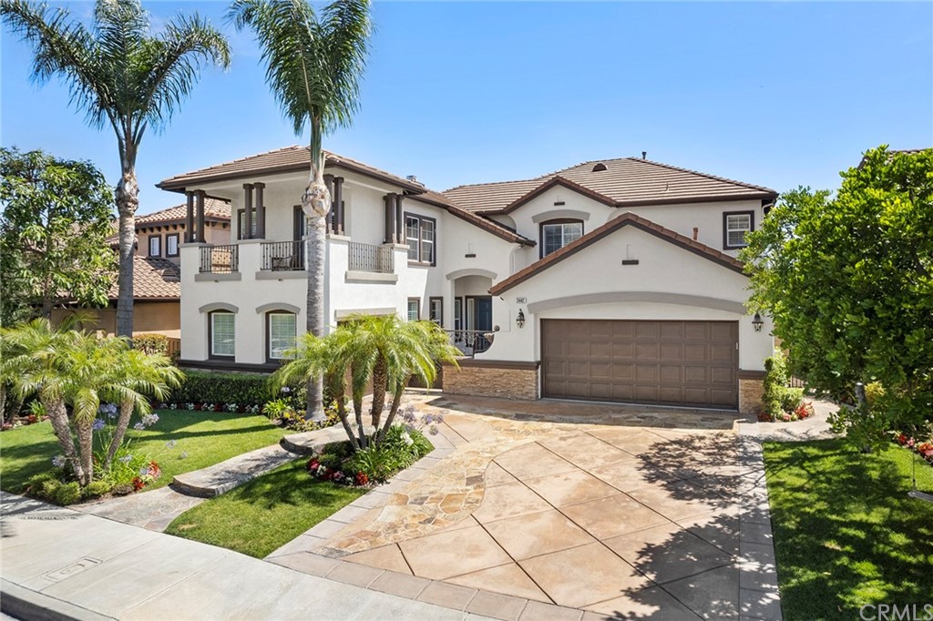 2442 Hawksfield Way Orange, CA 92867 - Photo 27 of 28 a front view of a house with a garden