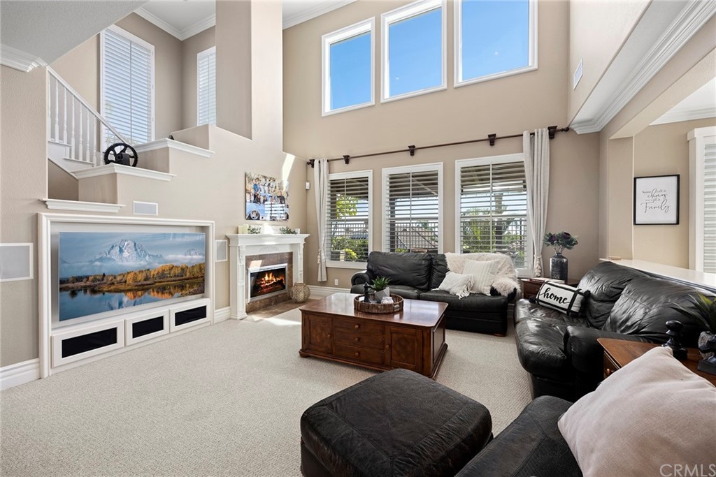 2442 Hawksfield Way Orange, CA 92867 - Photo 7 of 28 a living room with furniture fireplace and a large window