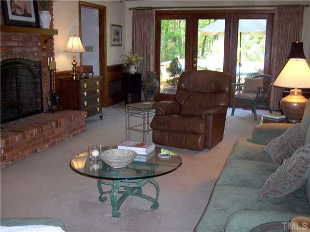 9321 Foxburrow Court Raleigh, NC 27613 - Photo 7 of 12 a living room with furniture and a fireplace