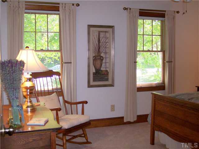 9321 Foxburrow Court Raleigh, NC 27613 - Photo 9 of 12 a living room with furniture and a window