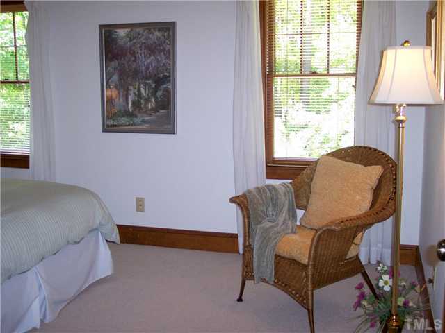 9321 Foxburrow Court Raleigh, NC 27613 - Photo 10 of 12 a room with furniture and a window