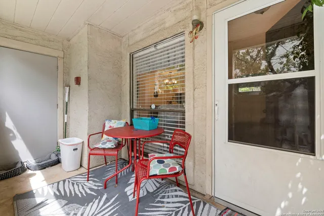 a balcony with furniture and outdoor view