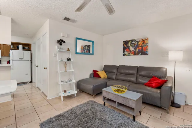 a living room with furniture and a couch