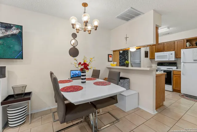 a view of kitchen and dining area with furniture