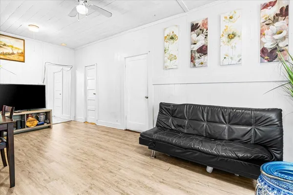 a living room with furniture and a flat screen tv