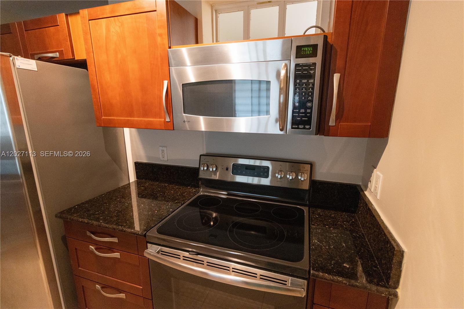 7275 Southwest 90th Way, Unit 213 Miami, FL 33156 - Photo 15 of 31 a close view of a stove top oven