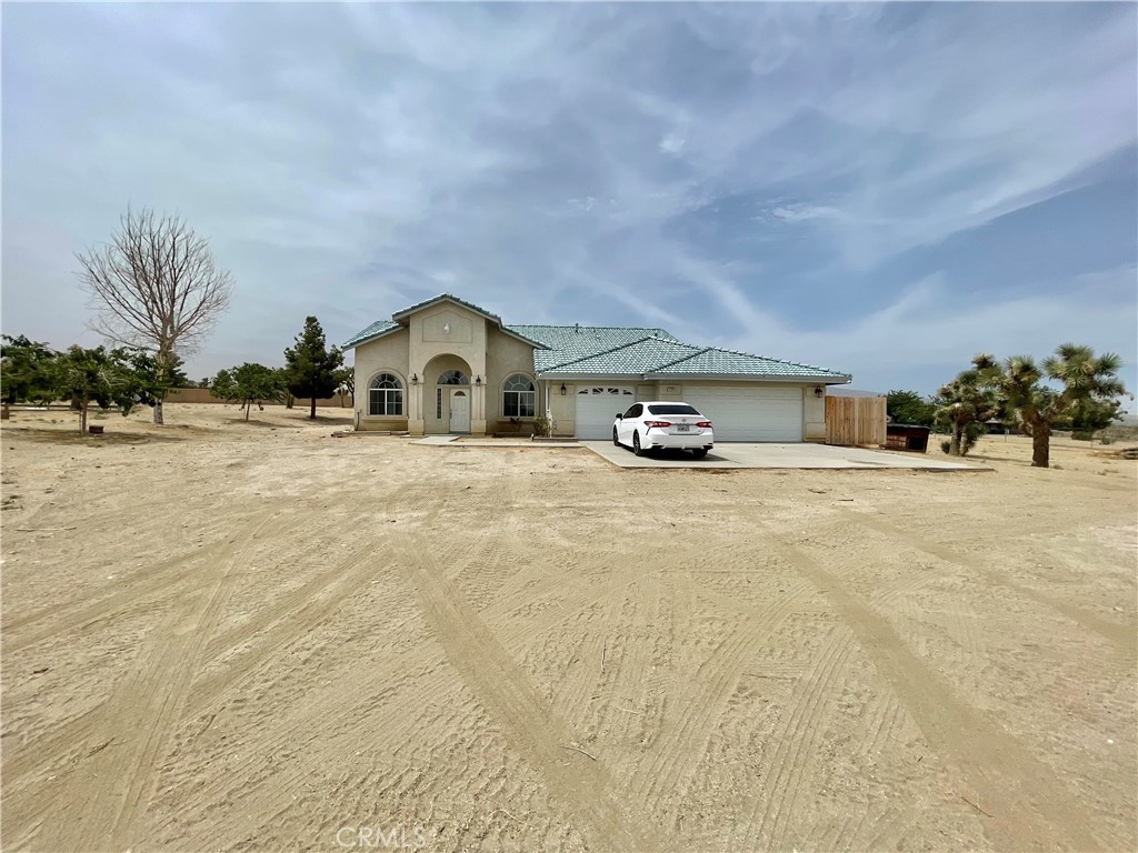 a big house with large trees and a big yard