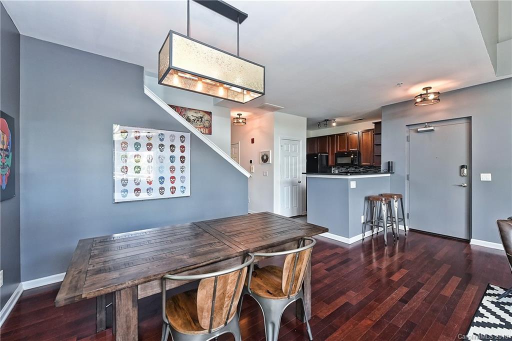609 Raphael Place Charlotte, NC 28205 - Photo 11 of 36 a view of a dining room with furniture and wooden floor