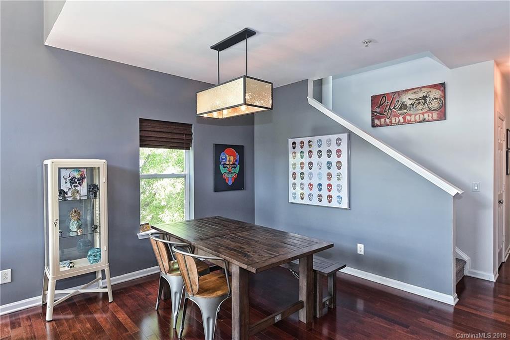 609 Raphael Place Charlotte, NC 28205 - Photo 12 of 36 a view of a dining room with furniture window and wooden floor