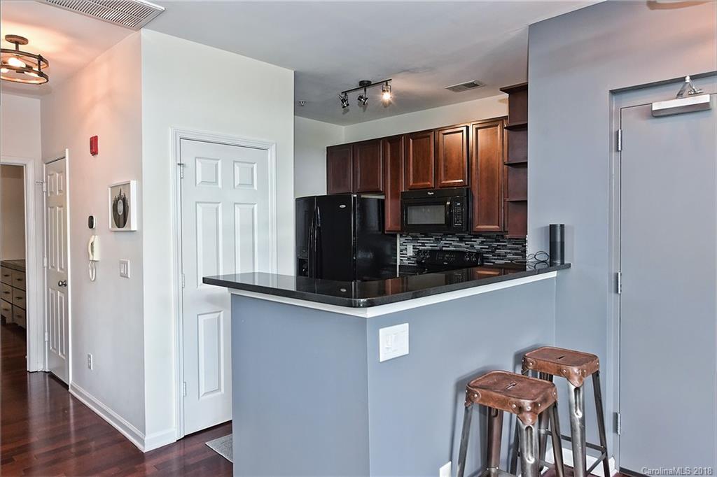 609 Raphael Place Charlotte, NC 28205 - Photo 16 of 36 a kitchen with stainless steel appliances granite countertop a refrigerator and a stove top oven