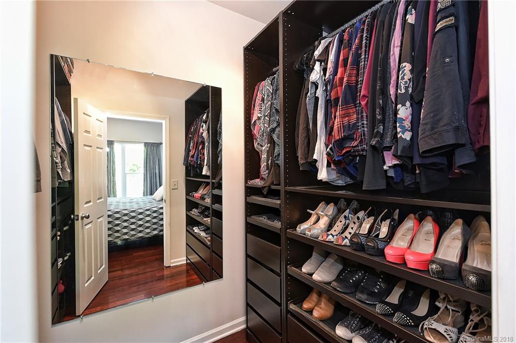 609 Raphael Place Charlotte, NC 28205 - Photo 23 of 36 a view of walk in closet with clothes and shoes