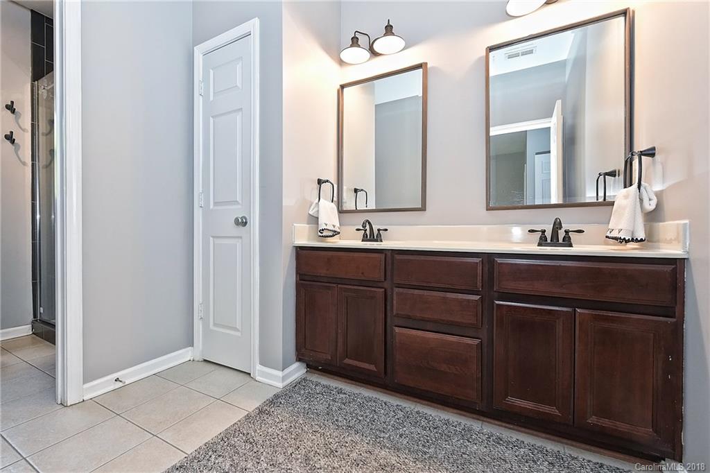 609 Raphael Place Charlotte, NC 28205 - Photo 24 of 36 a bathroom with a sink and a mirror