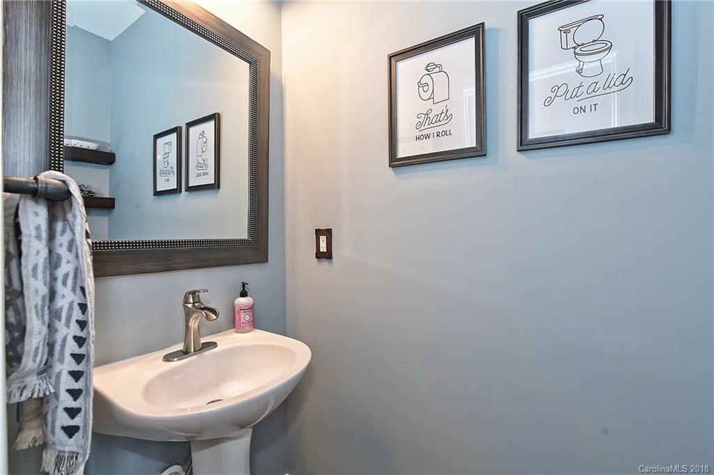 609 Raphael Place Charlotte, NC 28205 - Photo 26 of 36 a bathroom with a sink and a mirror
