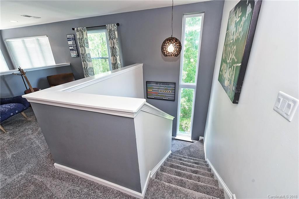 609 Raphael Place Charlotte, NC 28205 - Photo 27 of 36 a view of a hallway with windows