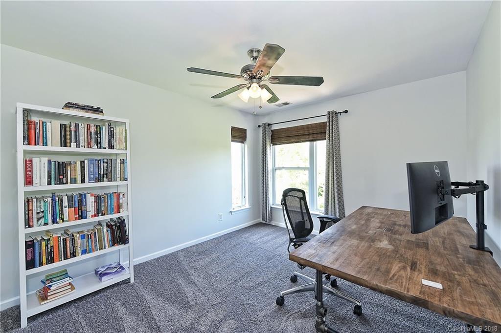 609 Raphael Place Charlotte, NC 28205 - Photo 30 of 36 a workspace with furniture and a book shelf