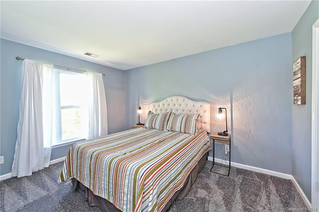 609 Raphael Place Charlotte, NC 28205 - Photo 31 of 36 a bedroom with a bed and a window