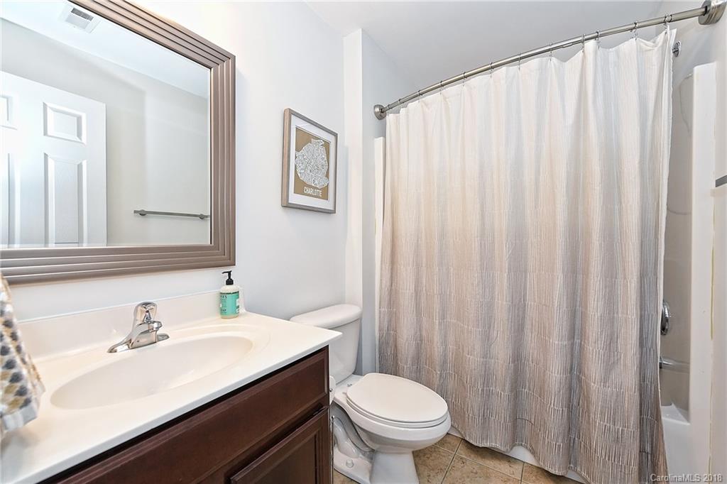 609 Raphael Place Charlotte, NC 28205 - Photo 32 of 36 a bathroom with a sink and a mirror