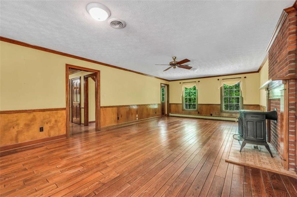 314 Winding Stream Trail Southwest Conyers, GA 30094 - Photo 21 of 59 a view of empty room with wooden floor and fan
