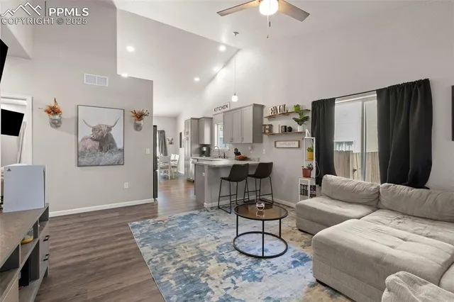 a living room with furniture and a table