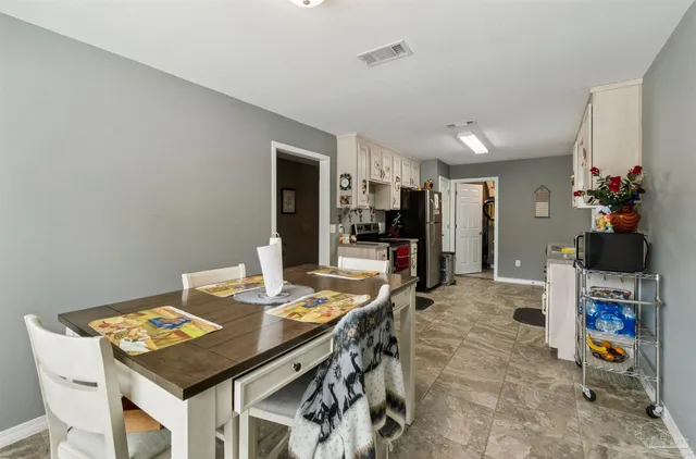 a view of a dining room with furniture