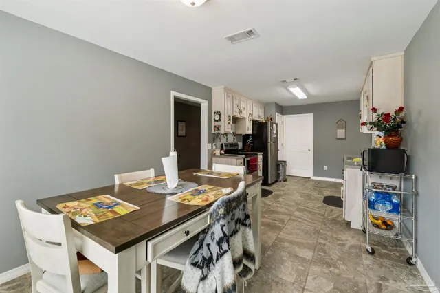 a view of a dining room with furniture
