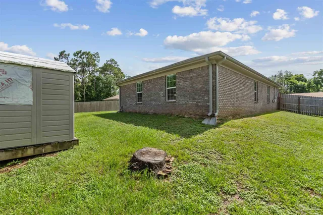 a backyard of a house with lots of green space