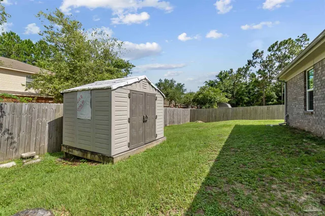 a view of a back yard of the house