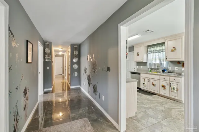 a bathroom with a shower sink and mirror
