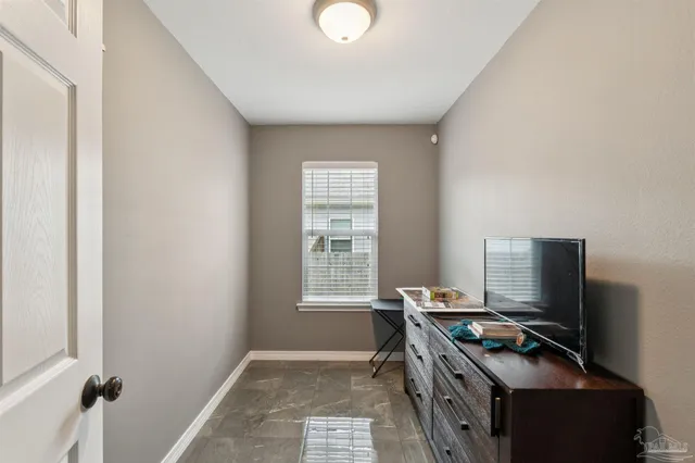 a room with furniture and a window