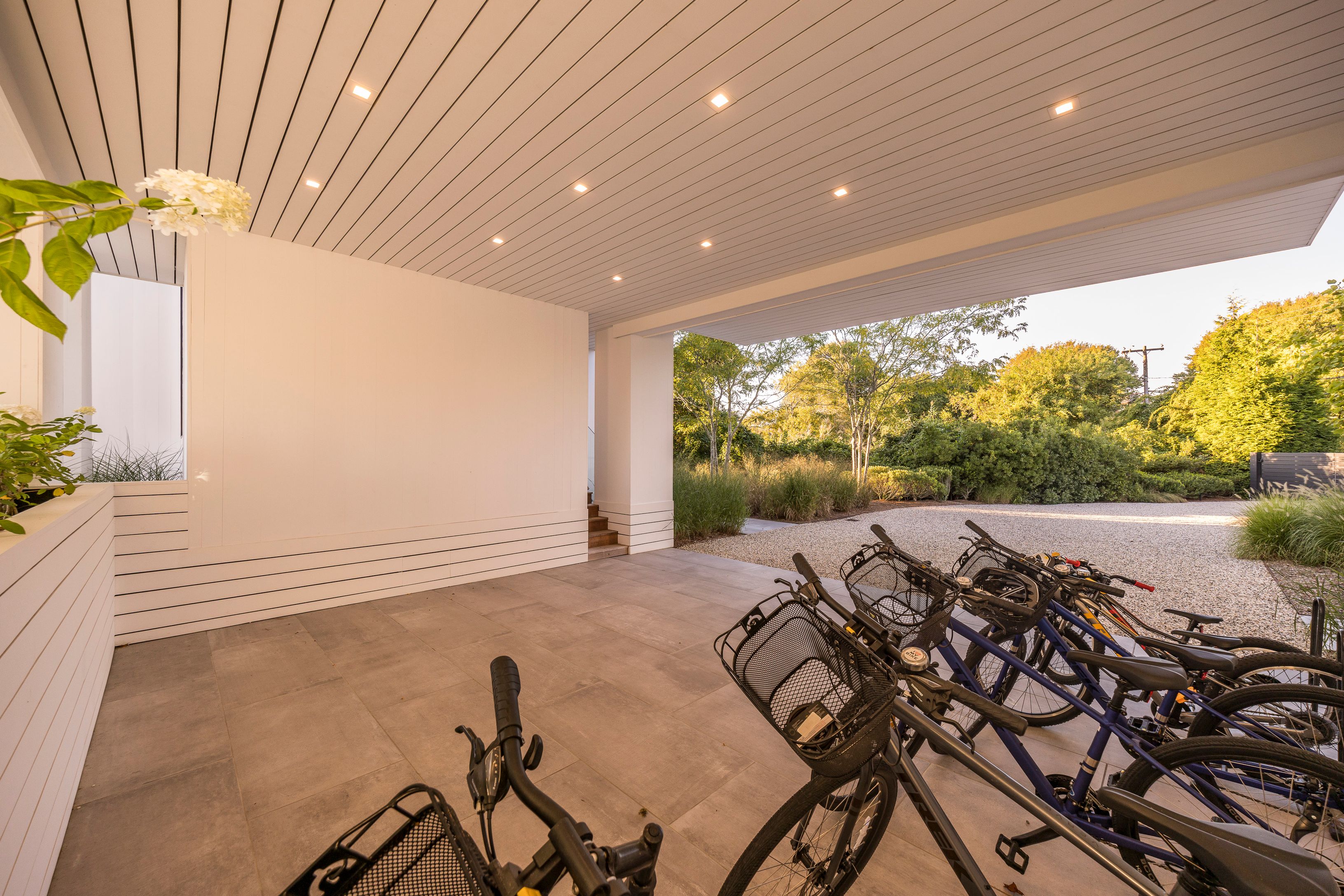 1076 Ocean Road Bridgehampton, NY 11932 - Photo 28 of 38 a view of a porch with furniture and garden