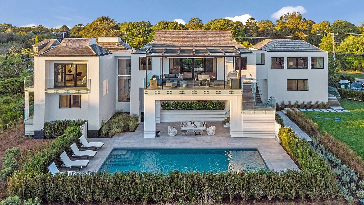 1076 Ocean Road Bridgehampton, NY 11932 - Photo 3 of 38 a front view of a house with garden