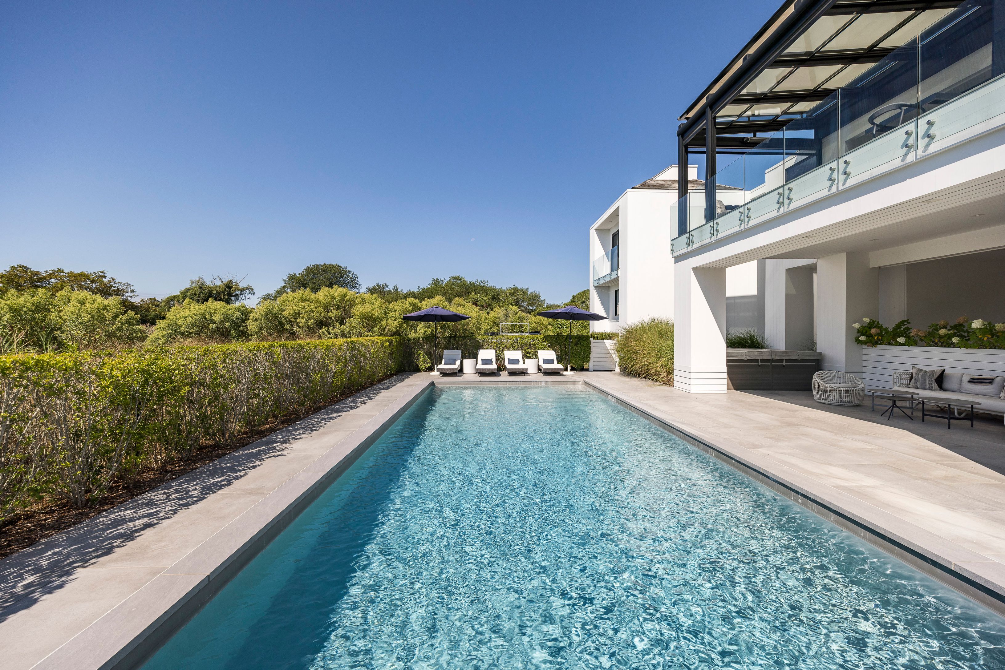 1076 Ocean Road Bridgehampton, NY 11932 - Photo 37 of 38 a view of a house with a yard