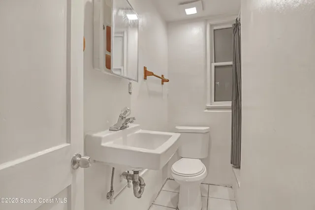 a view of room with window and furniture