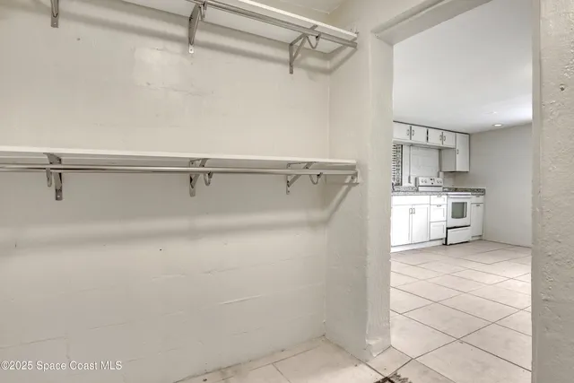 a bathroom with a toilet a sink a mirror and a window