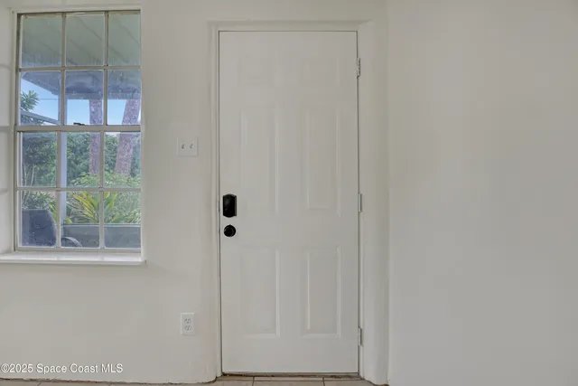 a view of an empty room and window