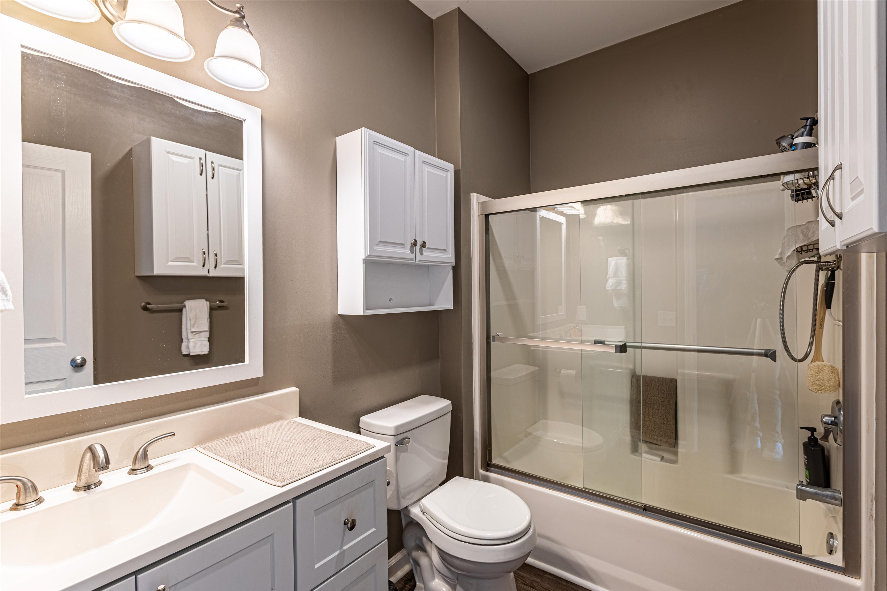 4585 Girvan Drive, Unit D Myrtle Beach, SC 29579 - Photo 12 of 32 Full bathroom with vanity and shower / bath combination with glass door