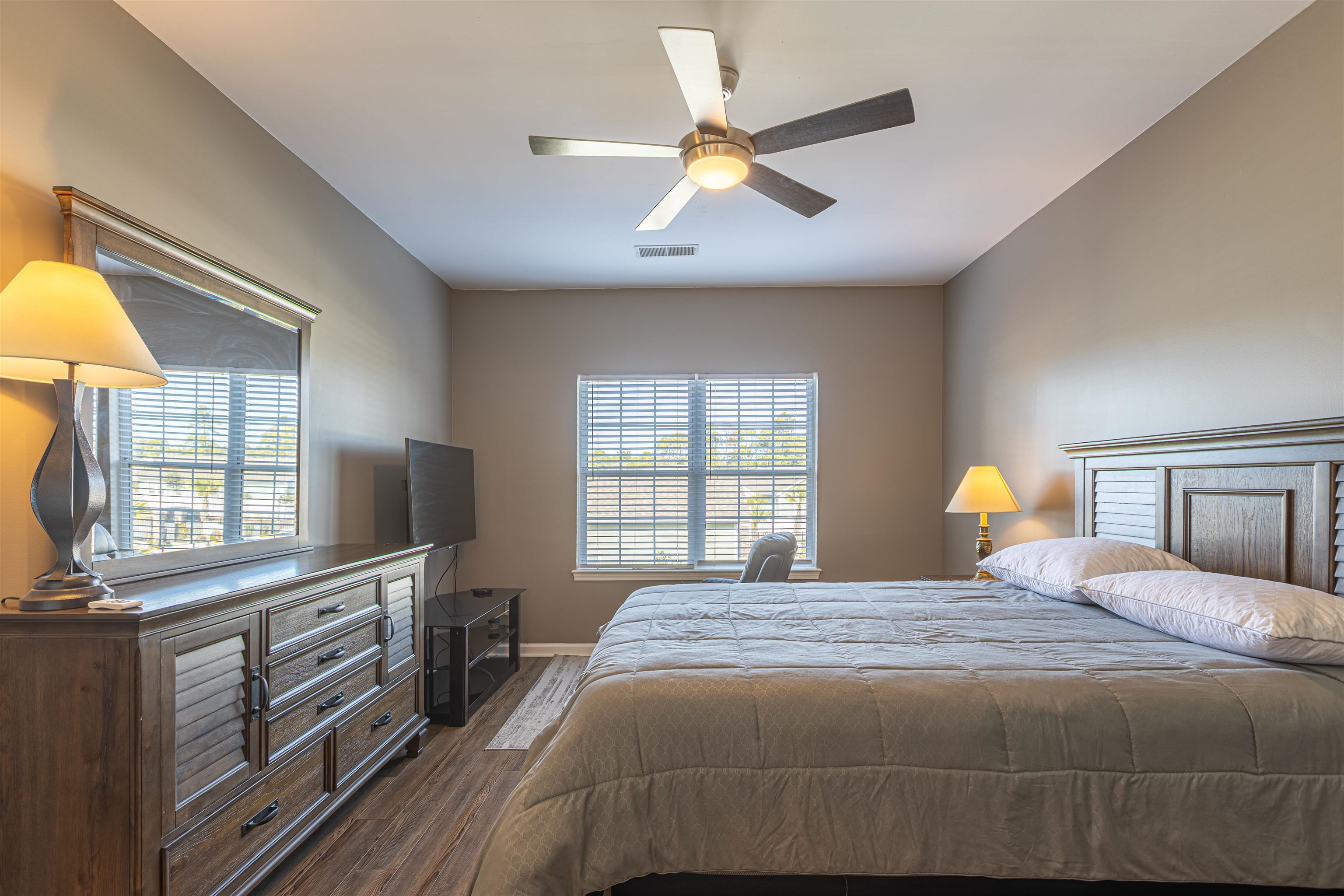 4585 Girvan Drive, Unit D Myrtle Beach, SC 29579 - Photo 14 of 32 Bedroom with dark wood finished floors and a ceiling fan