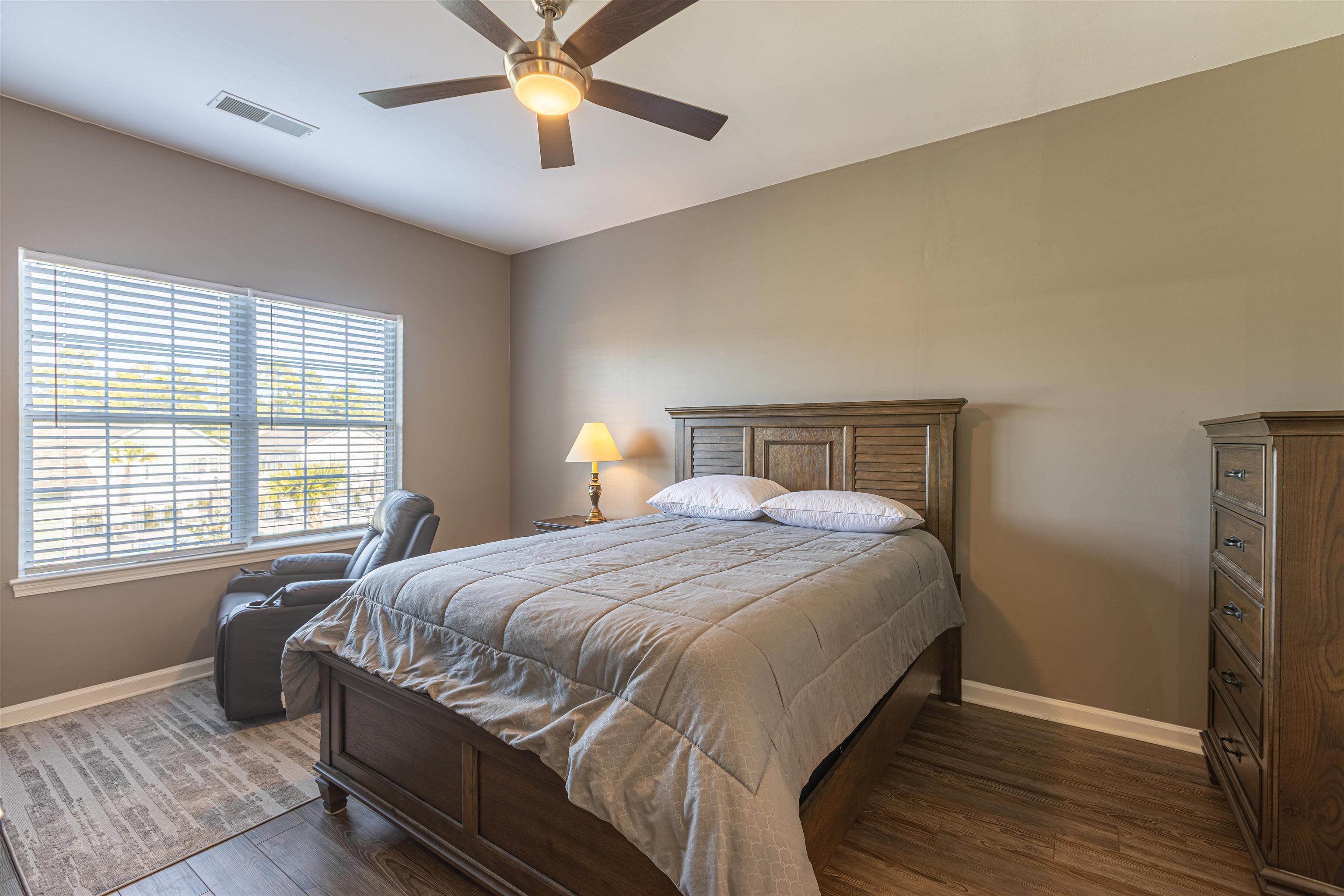 4585 Girvan Drive, Unit D Myrtle Beach, SC 29579 - Photo 15 of 32 Bedroom with dark wood finished floors and ceiling fan