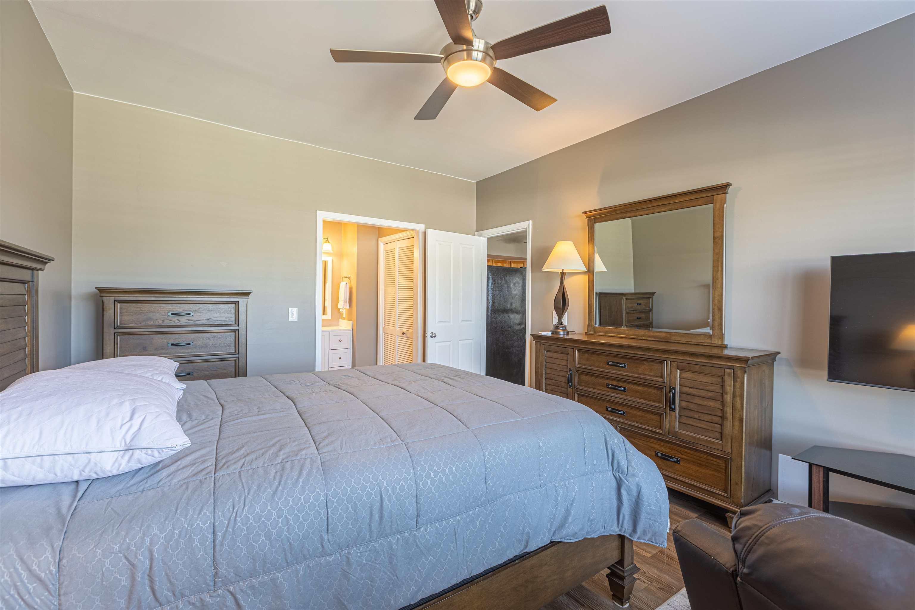4585 Girvan Drive, Unit D Myrtle Beach, SC 29579 - Photo 16 of 32 Bedroom with ceiling fan, ensuite bath, and a walk in closet