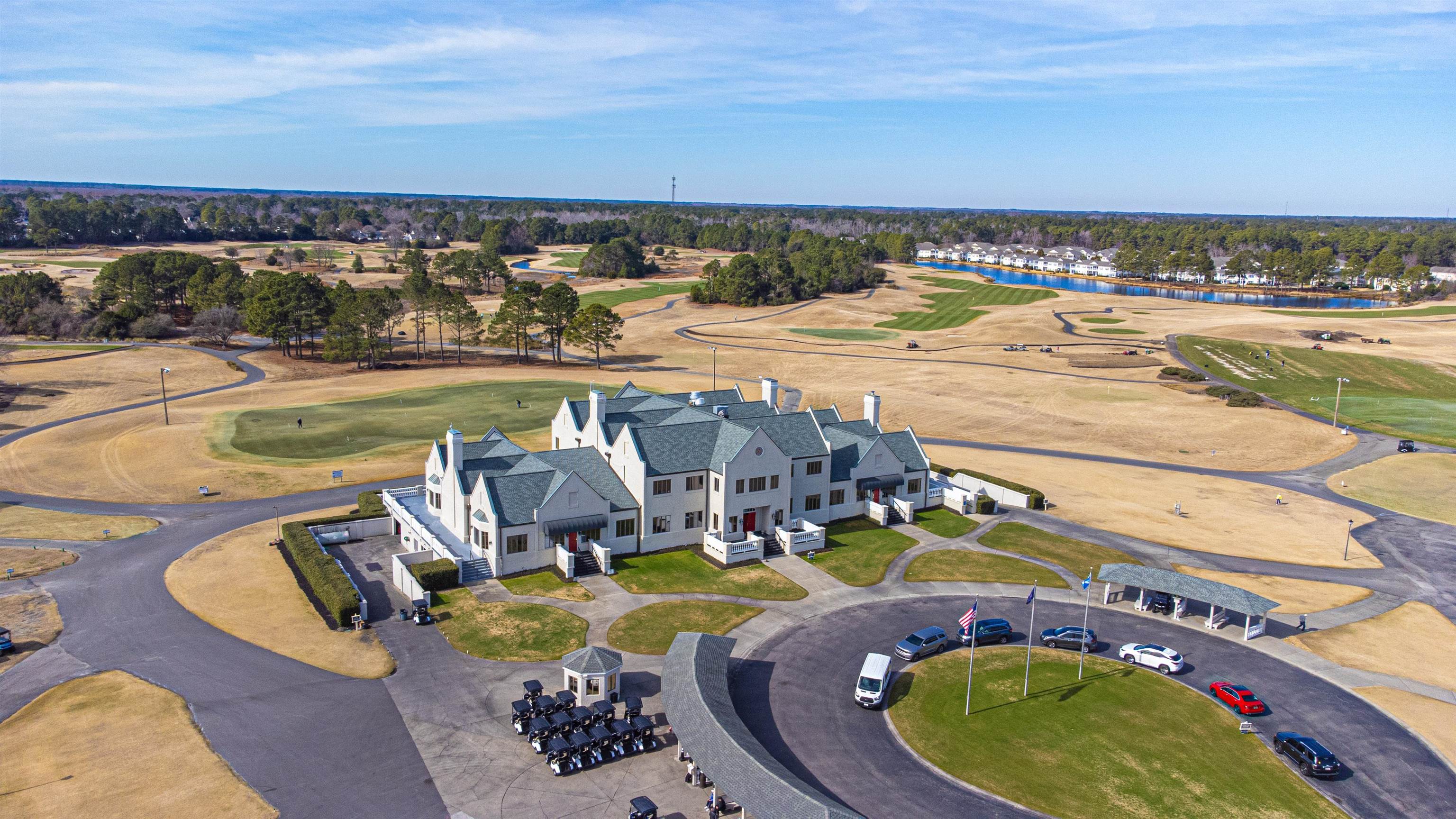 4585 Girvan Drive, Unit D Myrtle Beach, SC 29579 - Photo 29 of 32 Drone / aerial view of a golf course and a nearby body of water