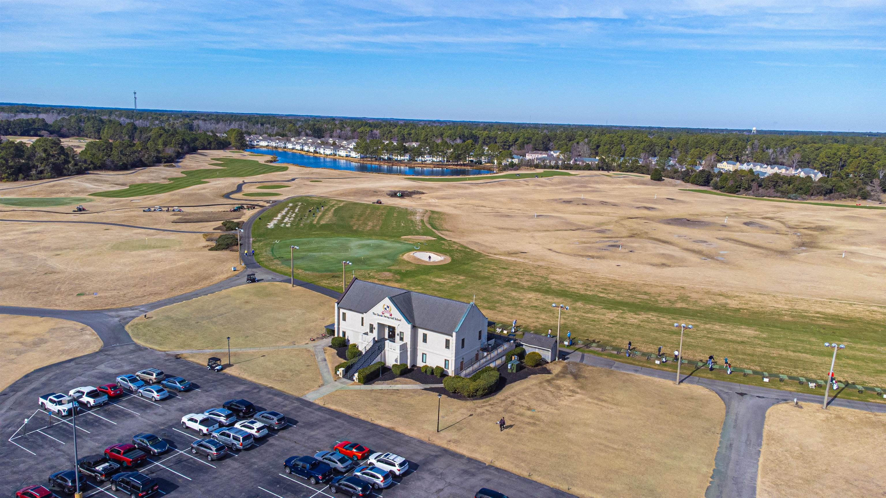 4585 Girvan Drive, Unit D Myrtle Beach, SC 29579 - Photo 30 of 32 Drone / aerial view of a large body of water and a golf club