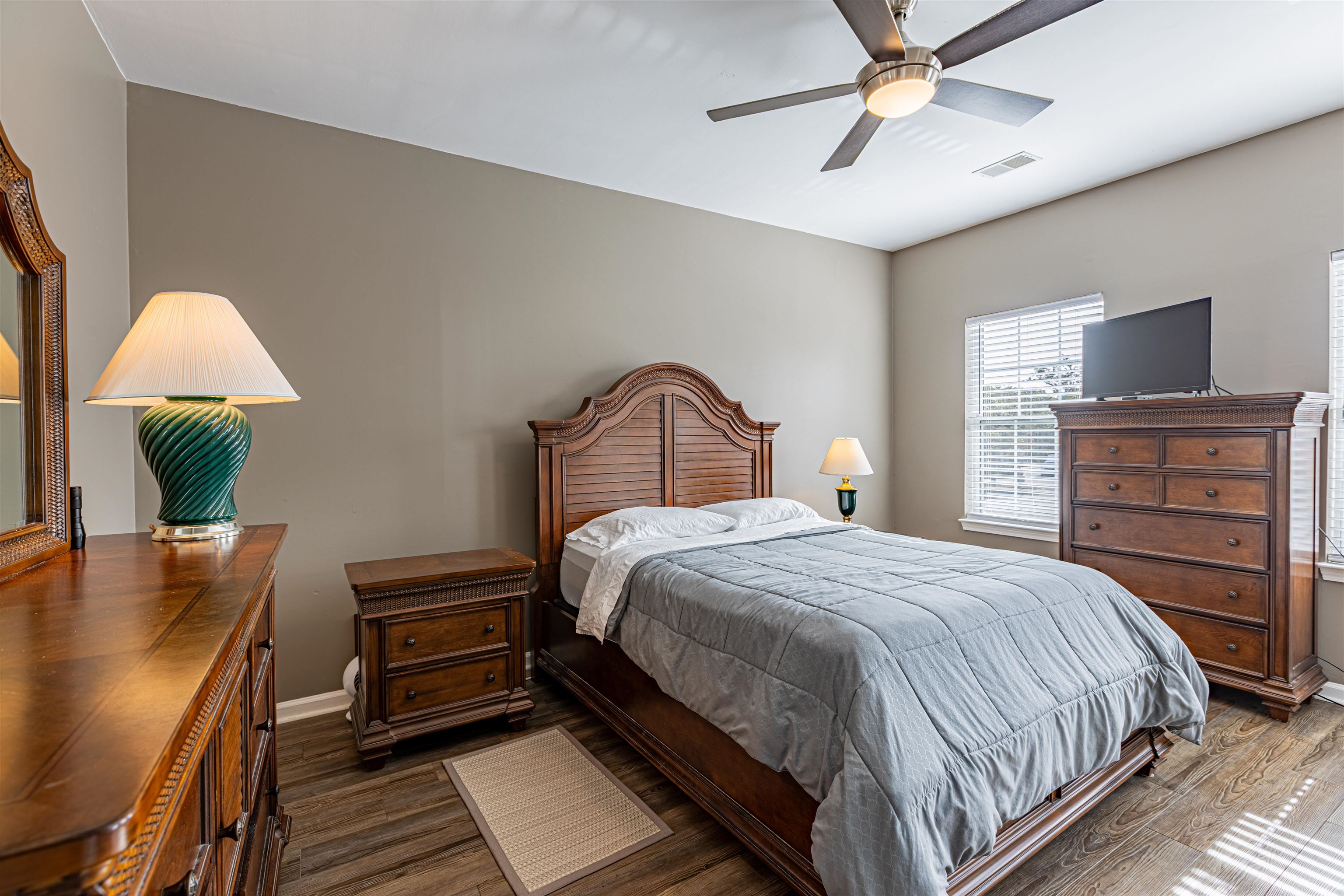 4585 Girvan Drive, Unit D Myrtle Beach, SC 29579 - Photo 8 of 32 Bedroom featuring wood finished floors and a ceiling fan