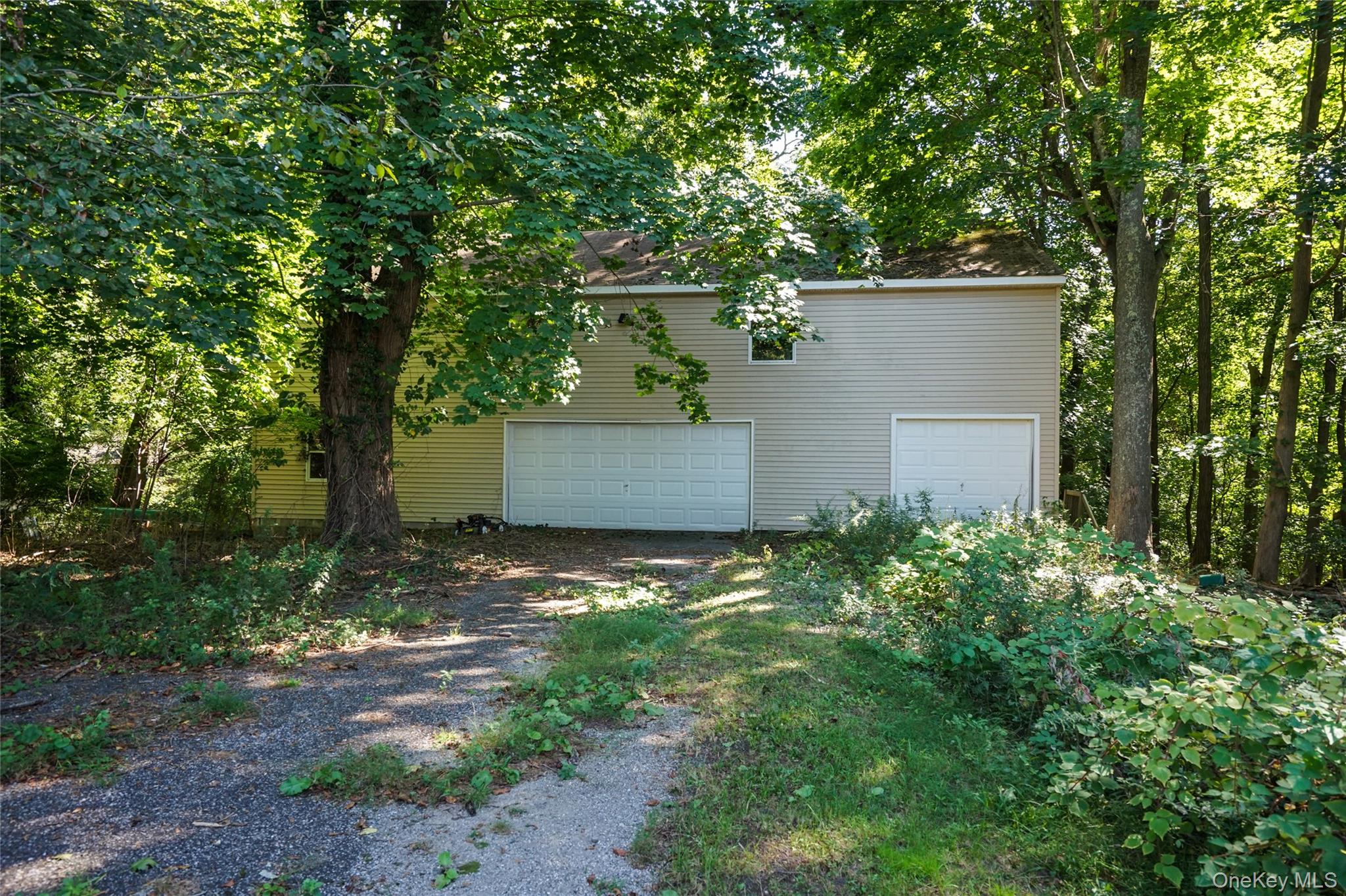 274 River Road St. James, NY 11780 - Photo 25 of 30 front view of a house with a tree