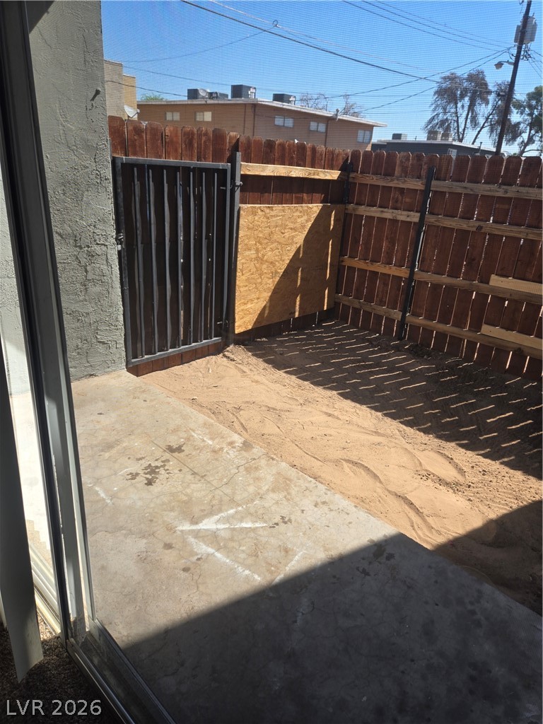 1388 East Desert Inn Road, Unit 2 Las Vegas, NV 89169 - Photo 19 of 23 This private, enclosed yard features a robust wood fence and ample space for outdoor enjoyment.