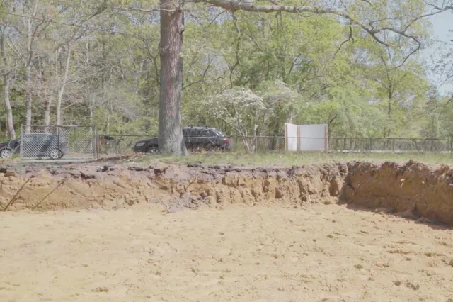 a view of a dry yard covered with snow