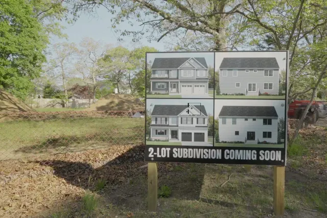 a view of a large building with a yard