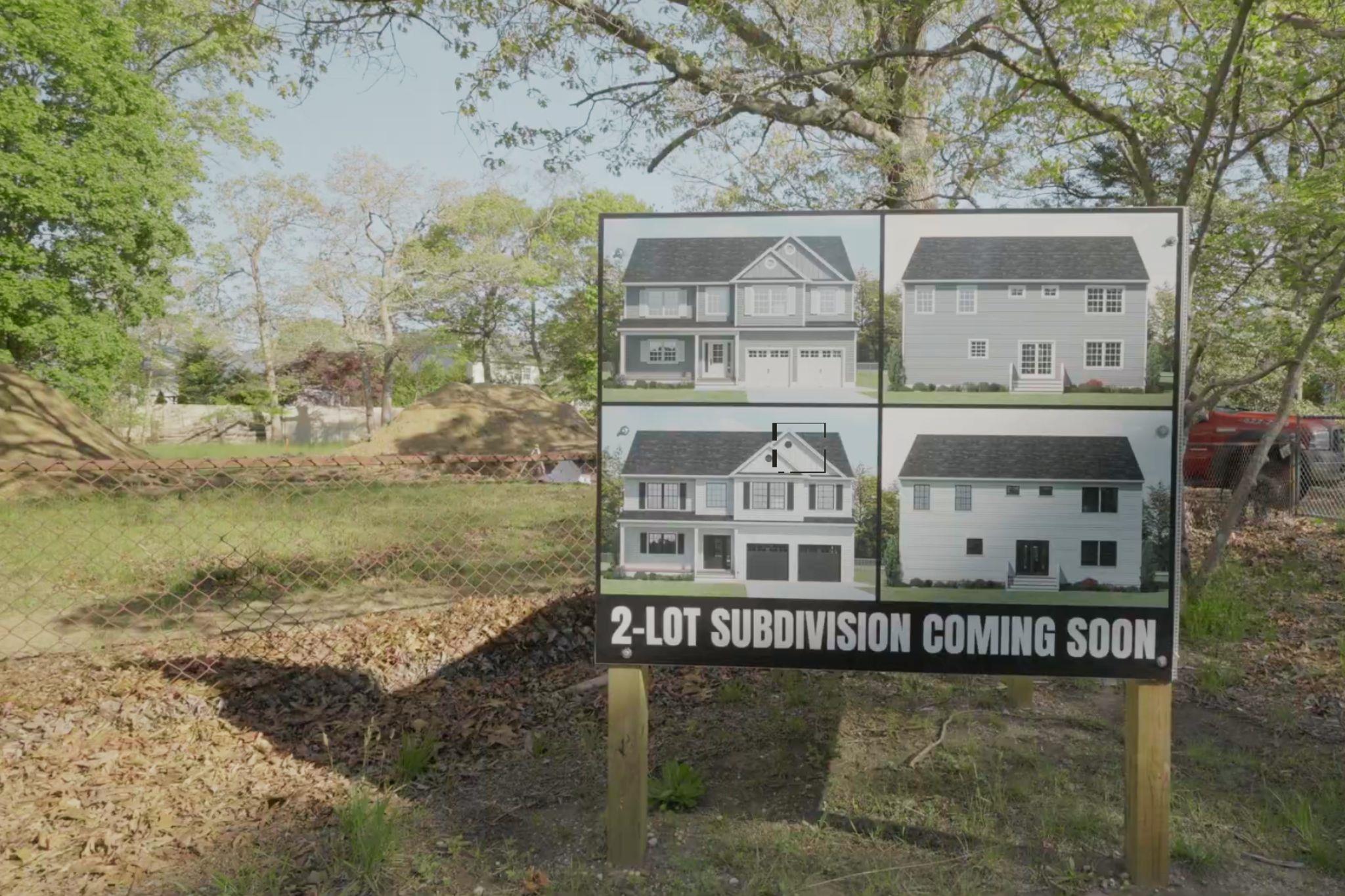 106 Schoolhouse Road East Islip, NY 11730 - Photo 20 of 26 a view of a large building with a yard