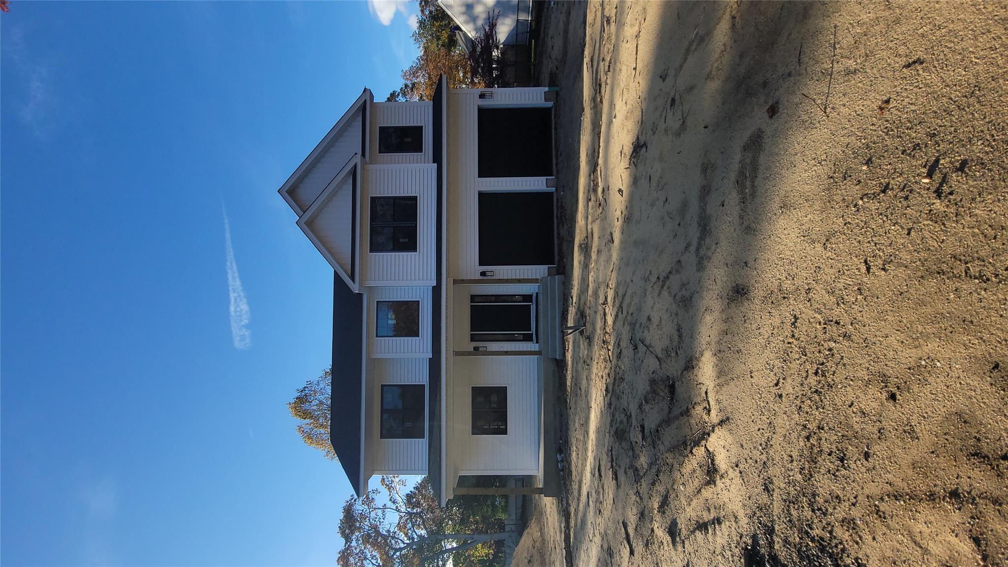 106 Schoolhouse Road East Islip, NY 11730 - Photo 22 of 26 a front view of a house with a yard