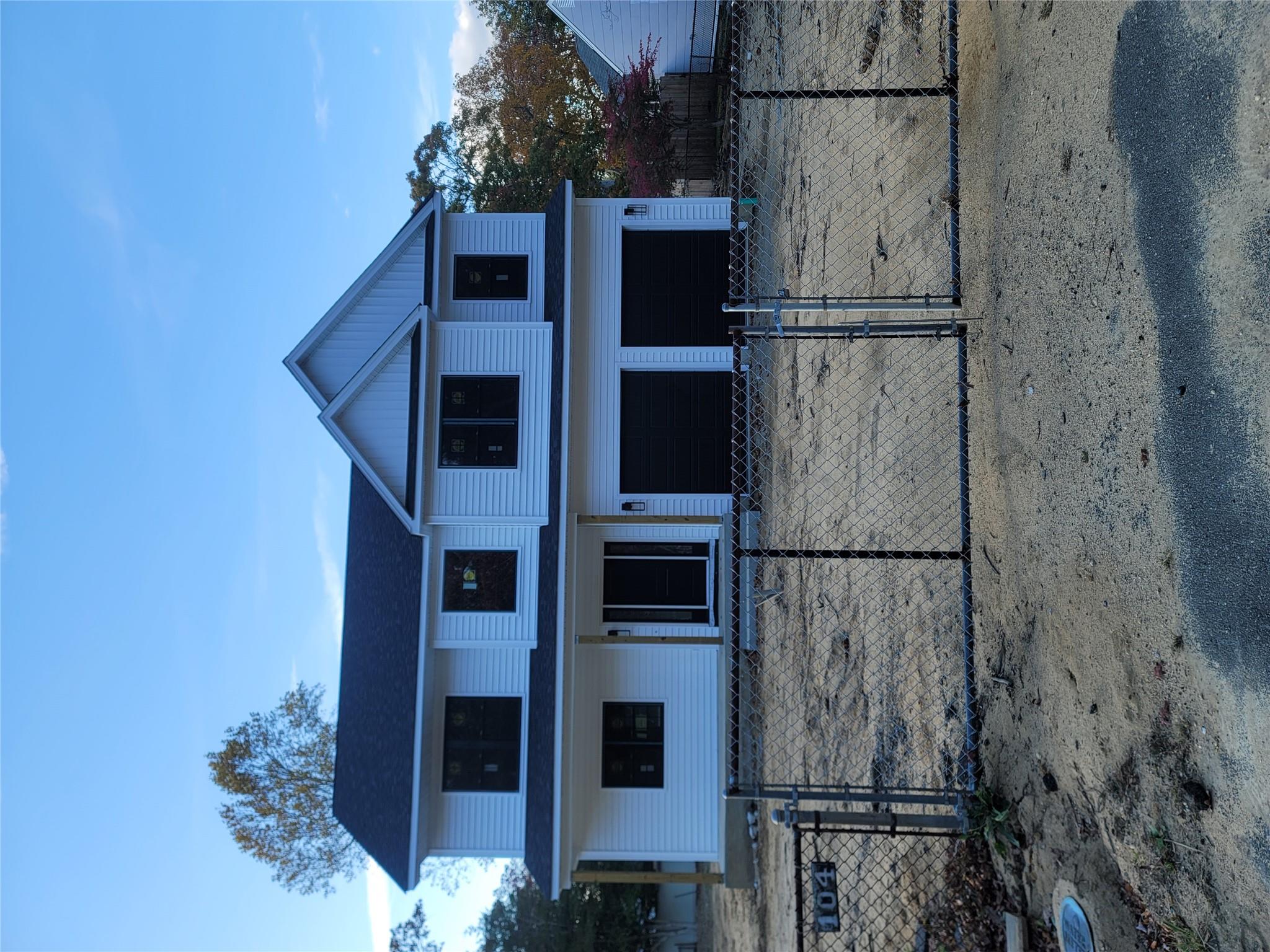 106 Schoolhouse Road East Islip, NY 11730 - Photo 3 of 26 a front view of a house with a yard
