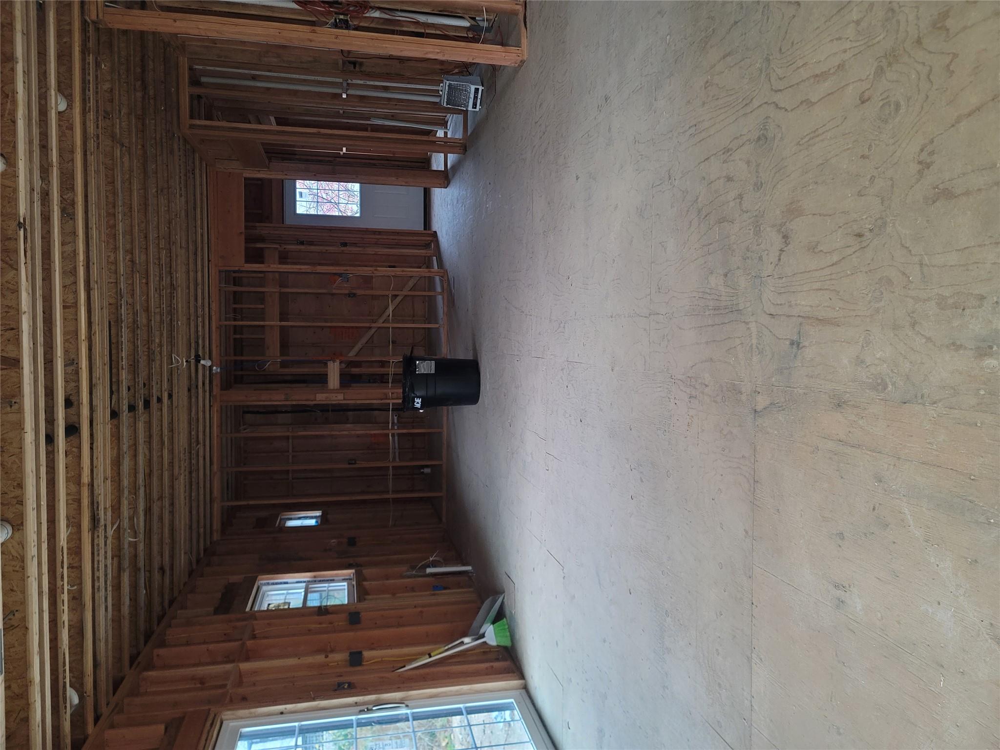 106 Schoolhouse Road East Islip, NY 11730 - Photo 7 of 26 an empty room with chair and windows